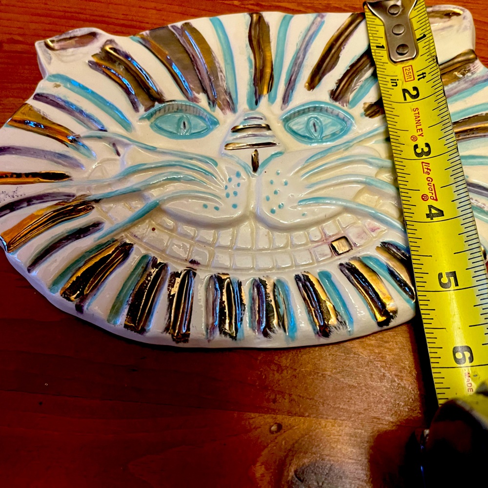 Ceramic cat mask .This unique piece can be hung on a wall .
